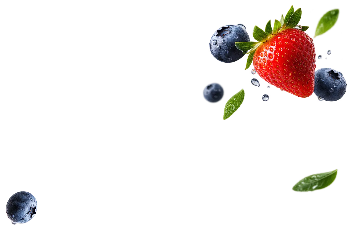 Fresh strawberries and blueberries with water droplets and green leaves